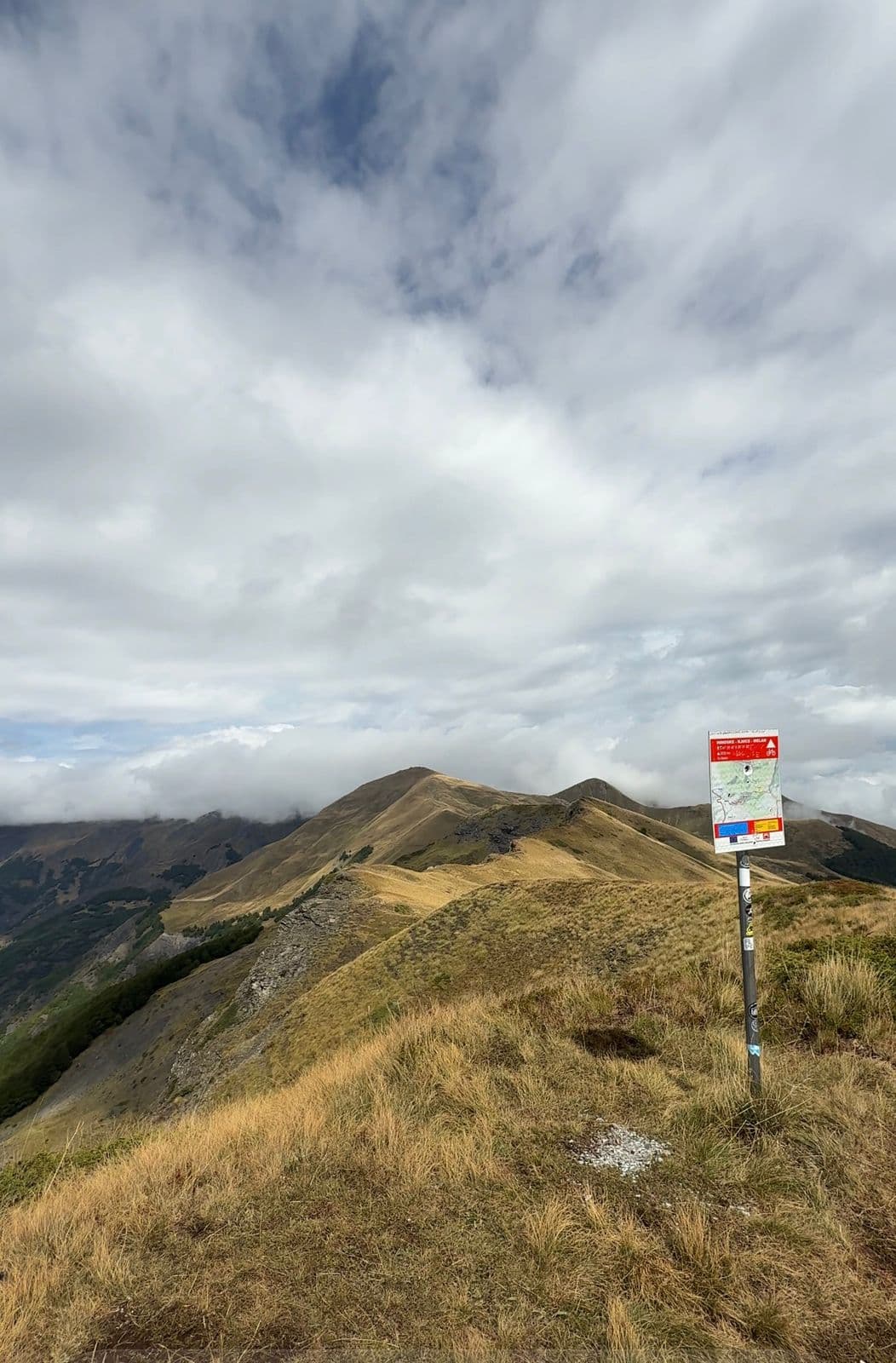 Trail marker sign at the Korabi mountain summit in Albania